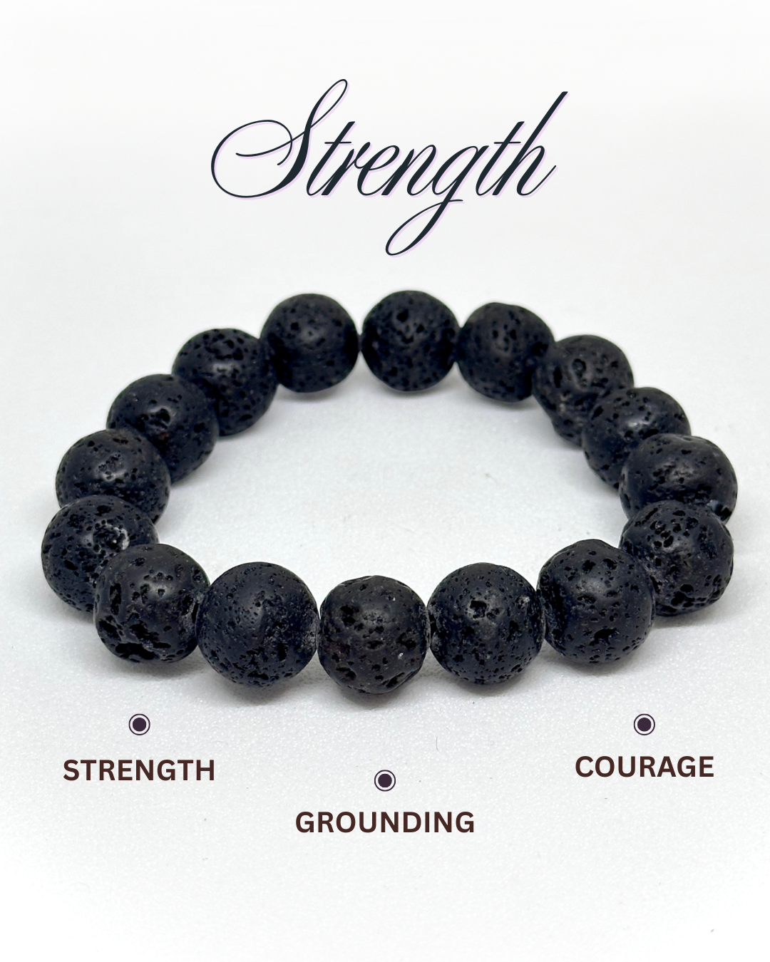 Black beaded lava bracelet on a white background with text 'Strength', 'Grounding', and 'Courage'.