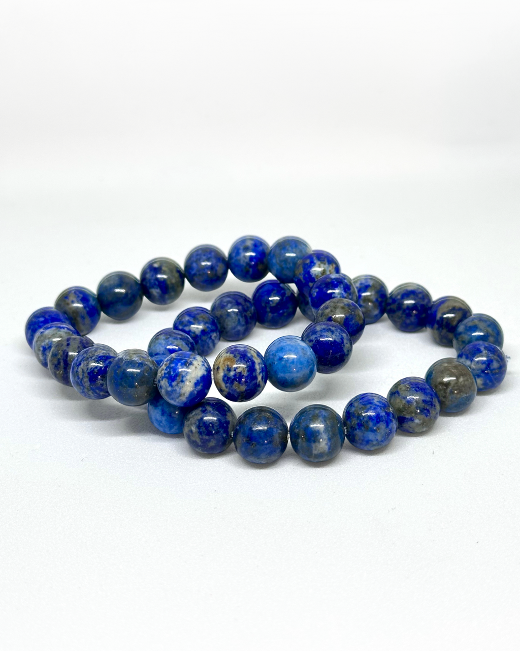 Blue Lapis 8mm bracelet on a white background